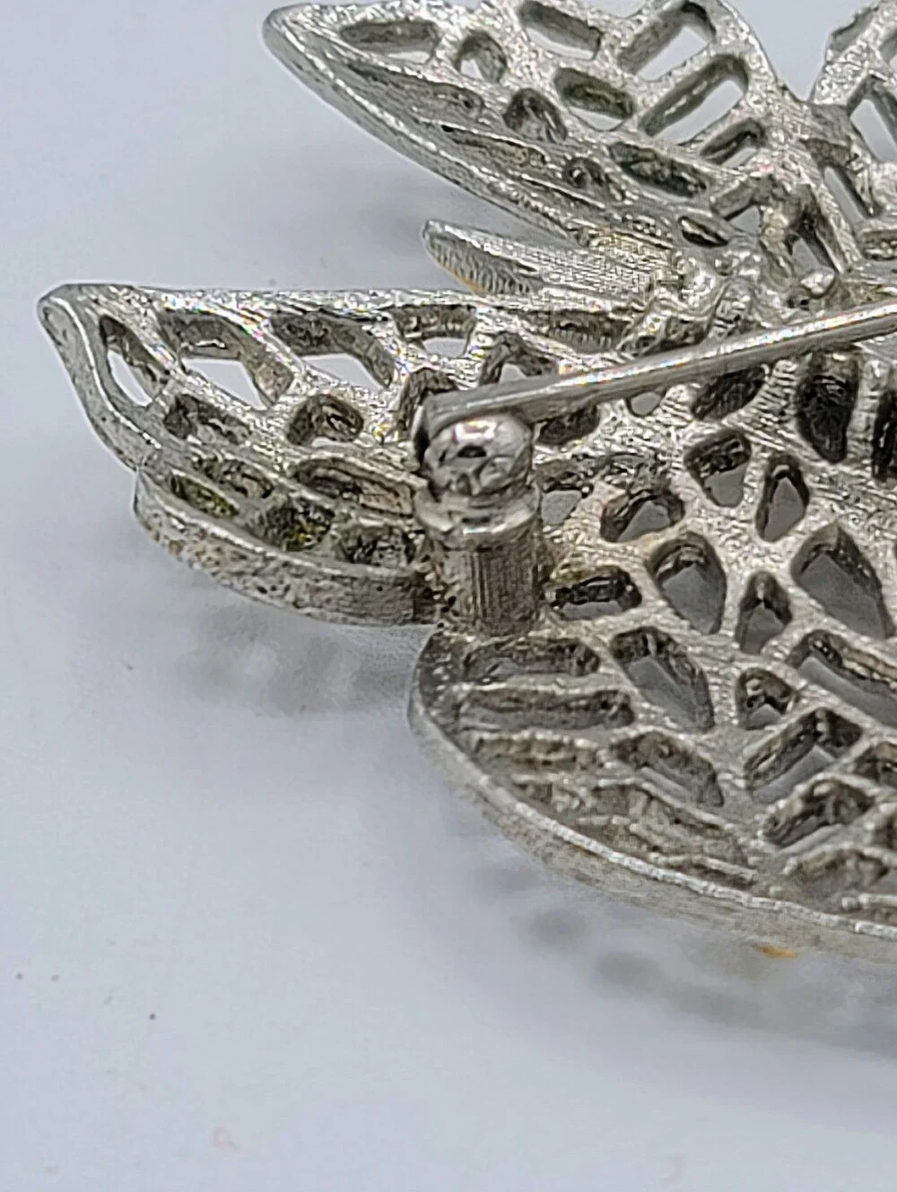 Avon Butterfly Brooch Two Tone Gold Silver Openwork Blue Rhinestone Eyes Vintage